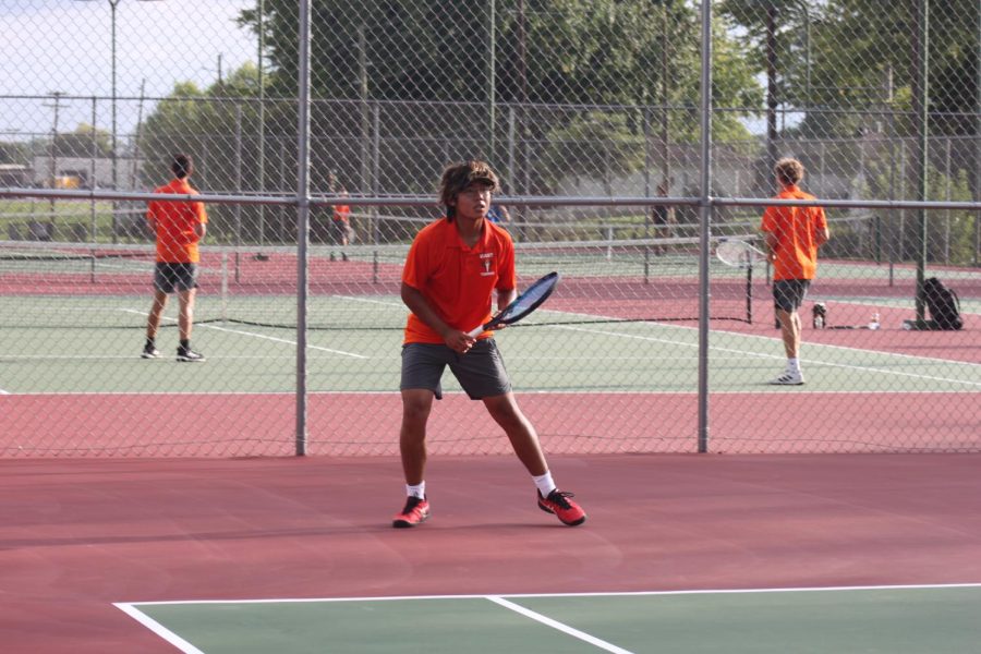 Junior Eric Takahashi watches opponent.